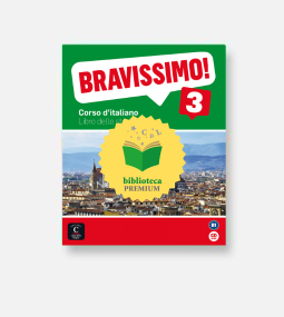 L'immagine mostra la copertina di un libro di testo di lingua italiana intitolato "Bravissimo! 3". La copertina raffigura un paesaggio urbano con montagne sullo sfondo e al centro un badge giallo "biblioteca premium".